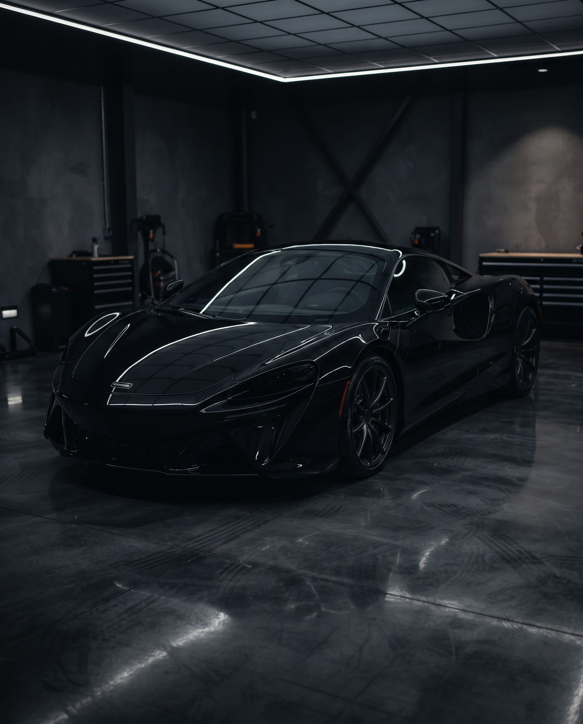 Freshly ceramic-coated car in dark garage lighting